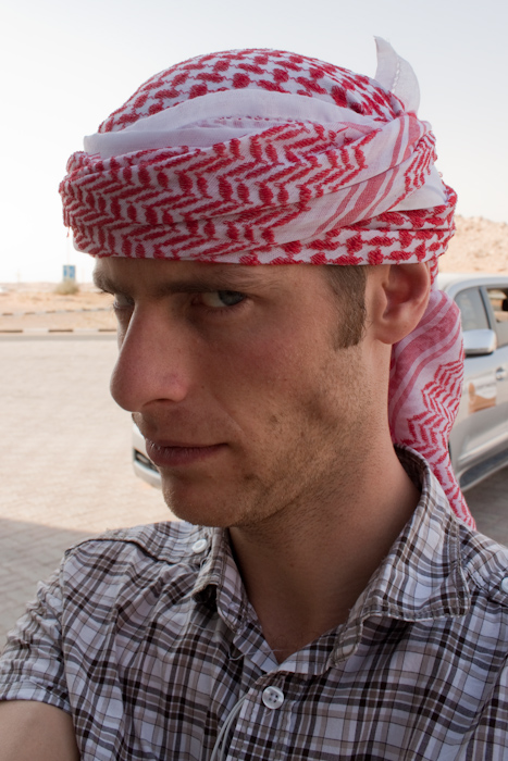 We drove out to the desert, stopping on the way a few times to buy drinks, food (I bought a Kinder Egg as it was Easter Sunday), and tourist trap tat. This is me after someone tried to convince me to buy a head scarf by actually wrapping it round my head.