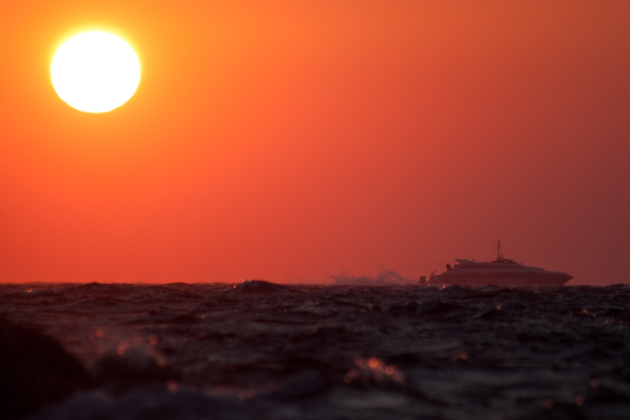 If I'd seen this boat on the horizon earlier, I might have framed it better. Either way, I think it's pretty dramatic. The horizon is so close here because I was literally crouching in the sea.