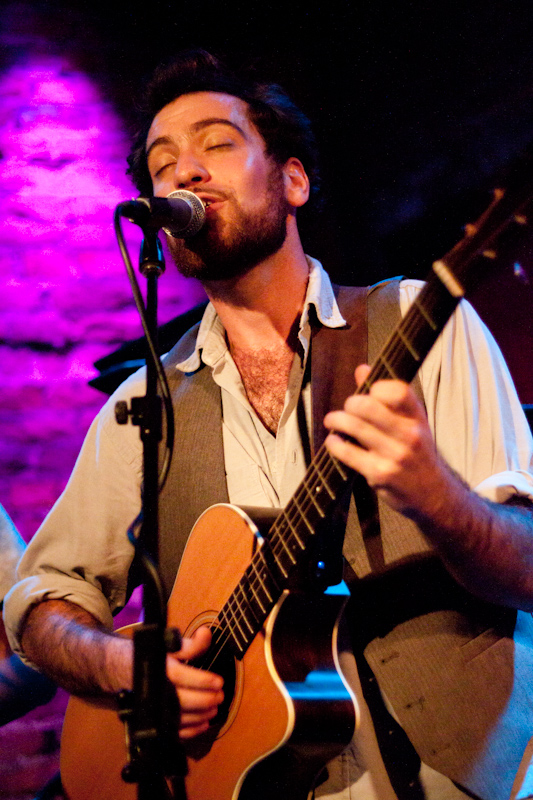 Excuse me while I talk about processing photos again. In my last post I mentioned how low light shots of musicians can be improved by converting to black and white. At the Rockwood Music Hall the lighting was pretty bright, and the light on the musicians was white, rather than red and green.