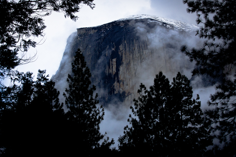 Half Dome peeks through the clouds and trees. This was my first glimpse of the rock.