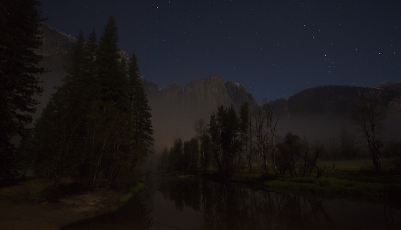 A view of the Yosemite Falls from the Swinging Bridge, as lit by star and moonlight.