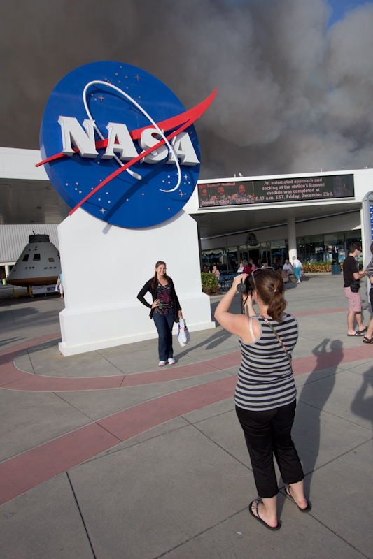 Kennedy Space Center: Visitor center entrance with bush fire smoke behind.