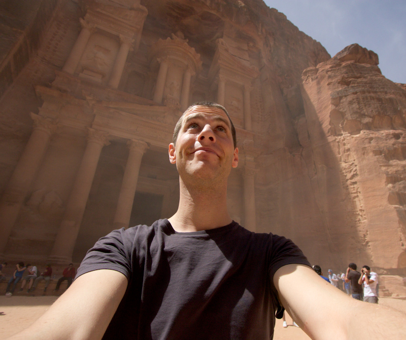 Petra, Jordan: The Treasury and me, doing my best to ignore the sand blasting in my face.