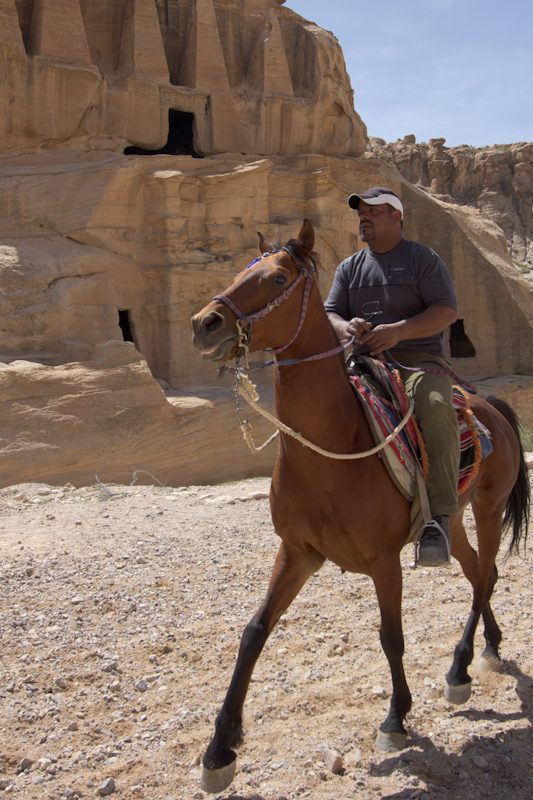 Petra, Jordan: Horse riding past the Obelisk tomb.